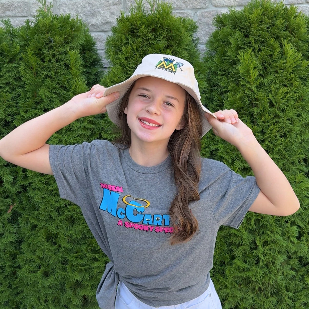 Audri wearing the Camp McCarty Bucket Hat outside