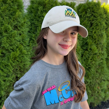 Audri wearing the Camp McCarty Dad Hat outside