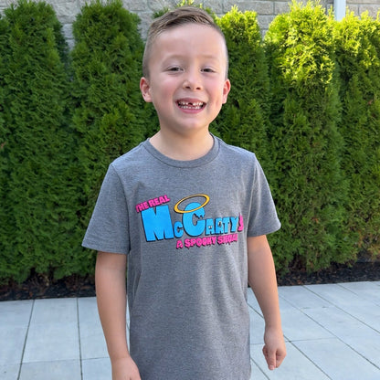 Braxton smiling while wearing the youth Spooky Special T-Shirt  outside