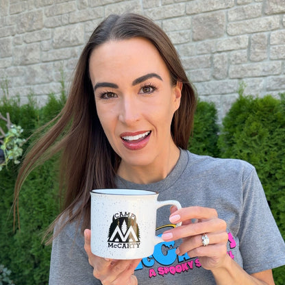 Stephanie holding the Camp McCarty mug